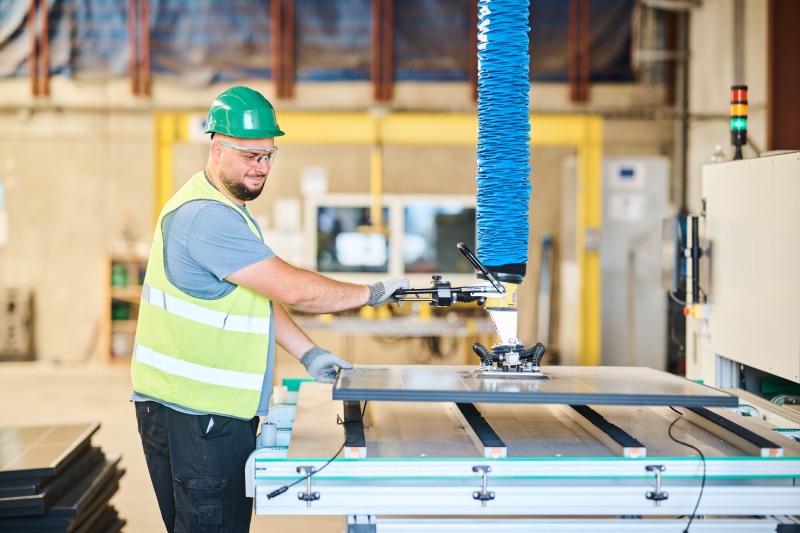Recma employee with solar panel