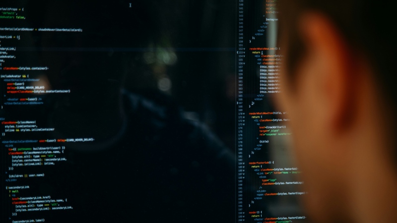 A man vibe coding on his computer