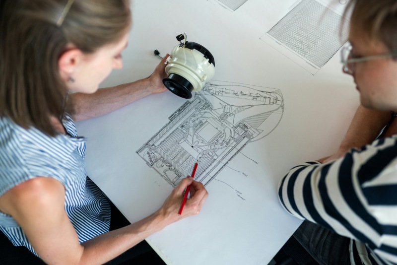 Engineers reviewing a produc design