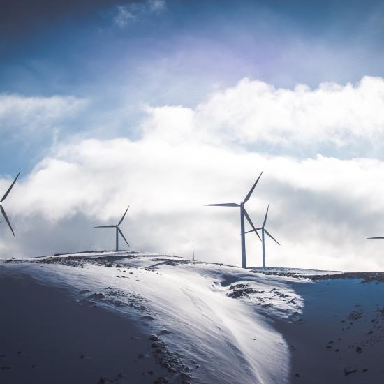 Wind turbine in snowy landscape