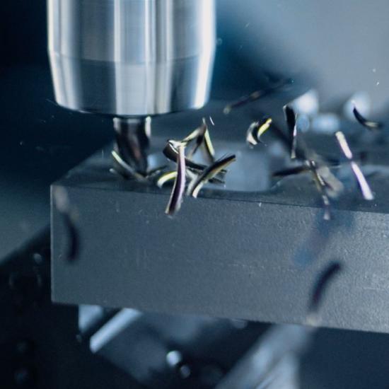 close-up of a metal component being machined