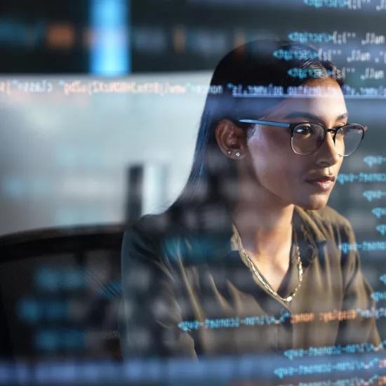 Woman coding on computer