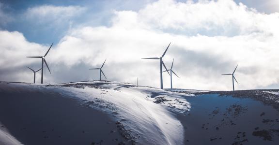 Wind turbine in snowy landscape