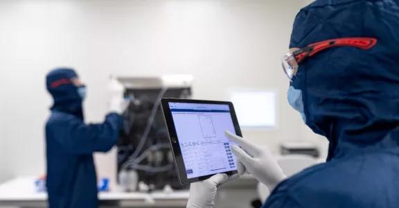 ABN smart product two men working on a pre-engineered and modular cleanroom
