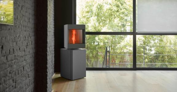 Stuv smart product remotely monitored and controlled pellet stove displayed in a room