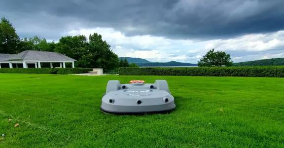 Echo Robotics smart robot lawn mower on a wide green lawn
