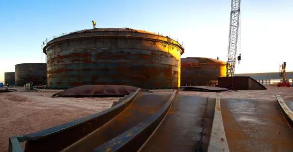 Large thermal storage tanks used in solar power generation, demonstrating efficient heat storage technology.