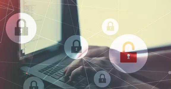 person-working-laptop-desk-with-illustrative-lock-icons-it-concept-cybersecurity