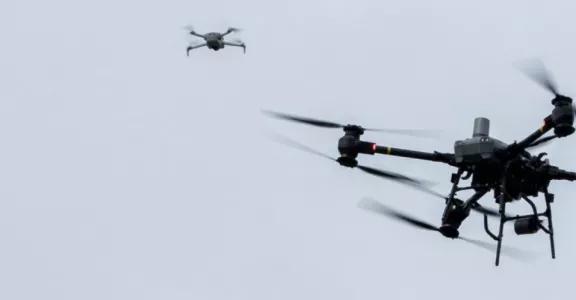 Drones flying through the sky 