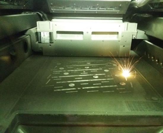 Adtractive laser manufacturing inside view on laser in action