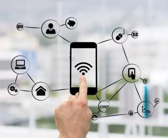 Finger touching drawing of smart phone with wifi sign and connections to other digital tokens