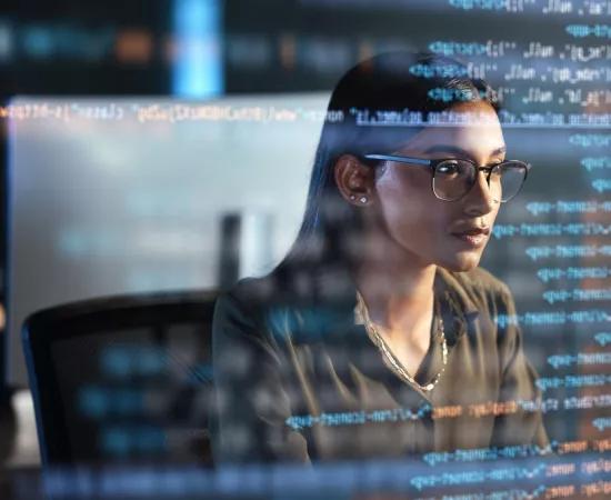 Woman coding on computer