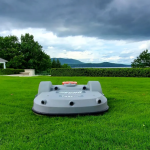 Echo Robotics smart robot lawn mower on a wide green lawn